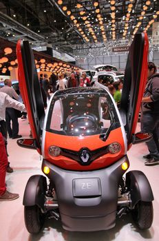 GENEVA - MARCH 8 : orange Renault Twizy ZE 2-seater on display at the 83st International Motor Show Palexpo - Geneva on March 8, 2013 in Geneva, Switzerland.