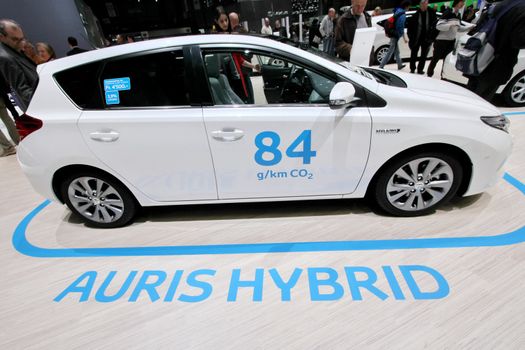 GENEVA - MARCH 8 : white Toyota auris hybrid car on display at the 83st International Motor Show Palexpo - Geneva on March 8, 2013 in Geneva, Switzerland.