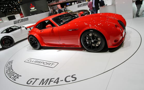 GENEVA - MARCH 8 : red wiesmann GT MF4-CS on display at the 83st International Motor Show Palexpo - Geneva on March 8, 2013 in Geneva, Switzerland. This car is completely hand-made by german constructor D�lmen.
