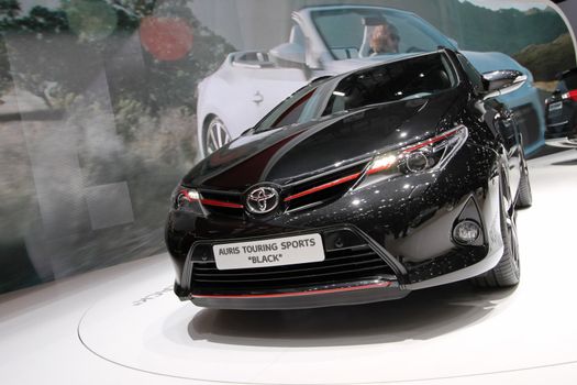 GENEVA - MARCH 8 : red and black Toyota Auris Touring sports on display at the 83st International Motor Show Palexpo - Geneva on March 8, 2013 in Geneva, Switzerland.