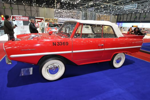 GENEVA - MARCH 8 : red and white Amphicar on display at the 83st International Motor Show Palexpo - Geneva on March 8, 2013 in Geneva, Switzerland.