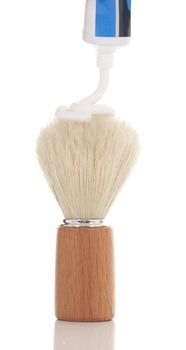 Retro badger shaving brush with a dollop of shaving cream