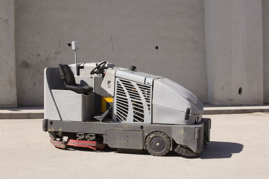 empty cleaning machine on road