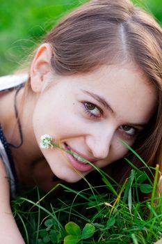 portrait of a beautiful young woman with flower  outdoor