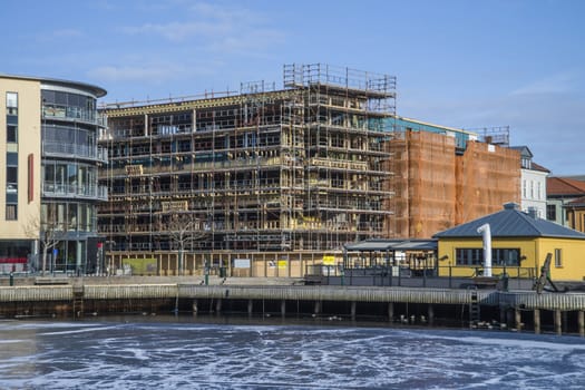 Close by Halden harbor being built a new commercial building in five floors. The picture is shot one day in March 2013.