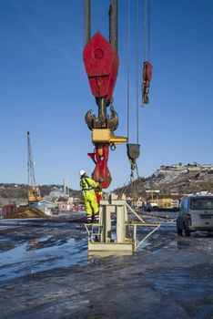 taklift, a giant seagoing crane with a lifting capacity of up to 400 tons at 45 meters, compared to the man on the picture you can see how big the hook is, the picture is shot on the quay at the port of halden february 2013