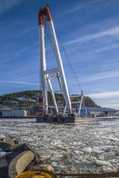 taklift, a giant seagoing crane with a lifting capacity of up to 400 tons at 45 meters dock at the port of Halden, the image is shot in february 2013.