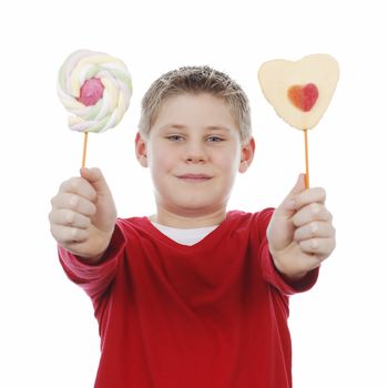 Portrait of beautiful joyful boy with two lollipops