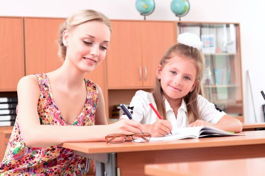 teachers are engaged with students, sitting next lesson explains