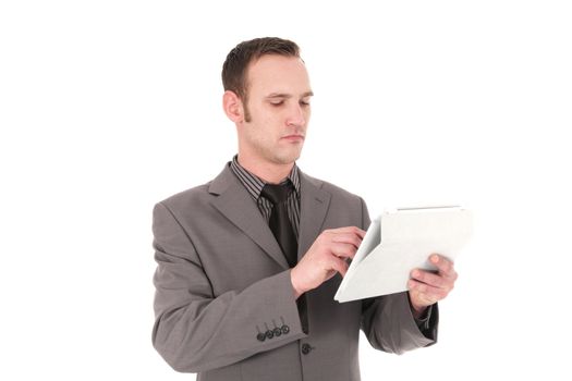 Resposible young businessman working on a Pc Tablet, on white background