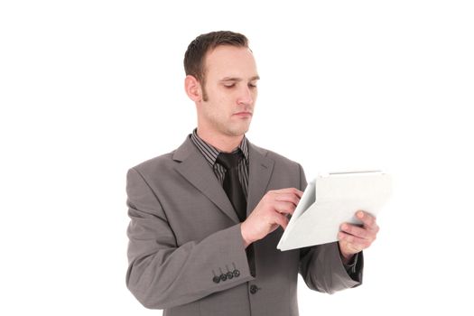 Resposible young businessman working on a Pc Tablet, on white background