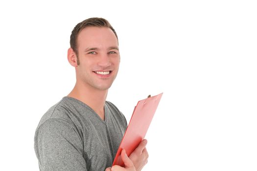 Handsome smiling man looking at the camera holding a red clipboard in his folded arms isolated on white