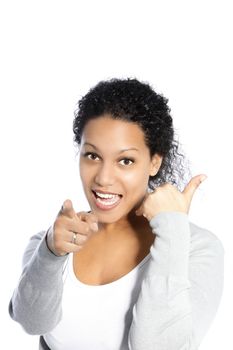 Vivacious beautiful African American woman pointing at the camera while giving a thumbs up sign with her other hand isolated on white
