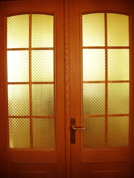 The image of beautiful wooden door with glasses