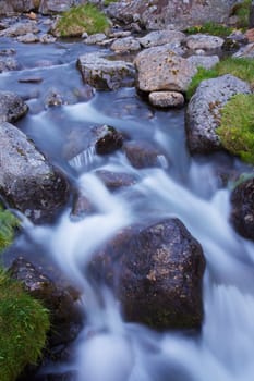 Small scenic water stream with rocks 