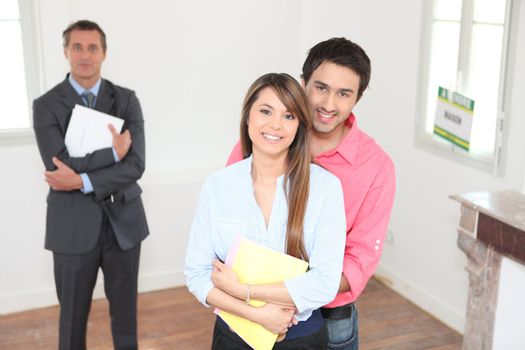 Happy young couple visiting house