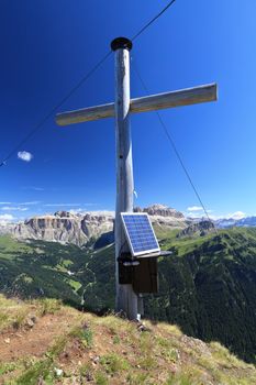 cross with solar panel on Crepa Neigra mount, Italian Dolomites