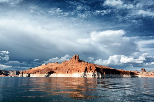 red cliffs reflected in the water of the lake Powell