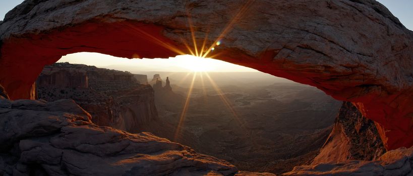 panoramic view of sunrise at Mesa Arch in Canyonlands National Park, Utah, USA 