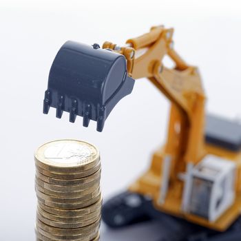 euro money coins with digger on white background 