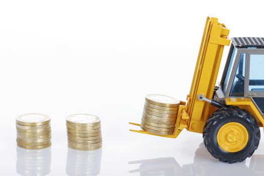euro money coins and forklift isolated on white background 