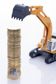 euro money coins and digger isolated on white background 