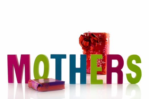 letters in red green blue with mothers text on white background