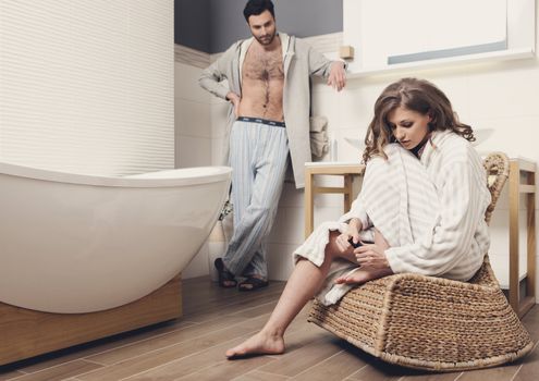 Young beautiful couple in the bathroom