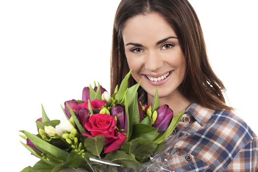 Happy smiling beautiful young woman with bouquet