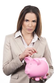 beautiful woman with piggy bank and coin