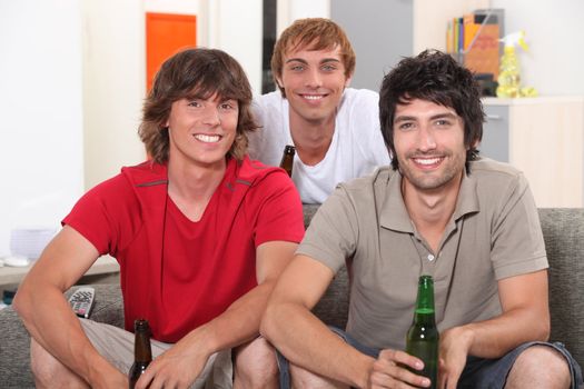 Flatmates enjoying a beer together