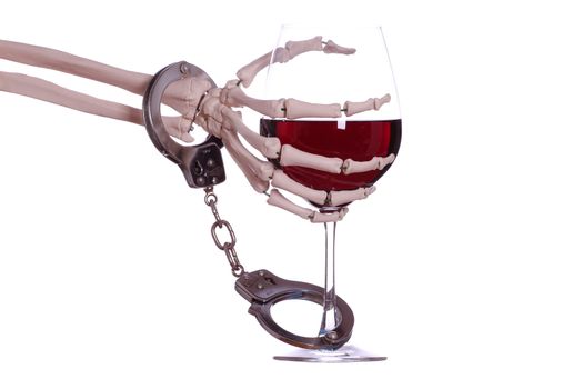 skeleton hand with wine and handcuff