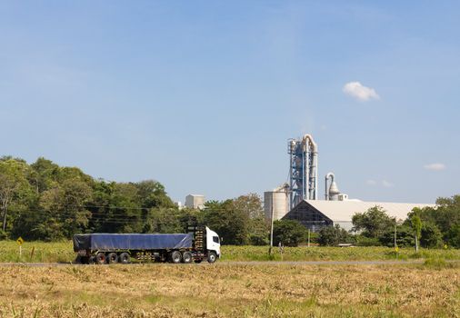 Truck driving on the road to the Industrial factory