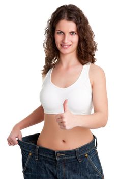 Woman seeing results from her diet and giving a thumbs up, isolated in white