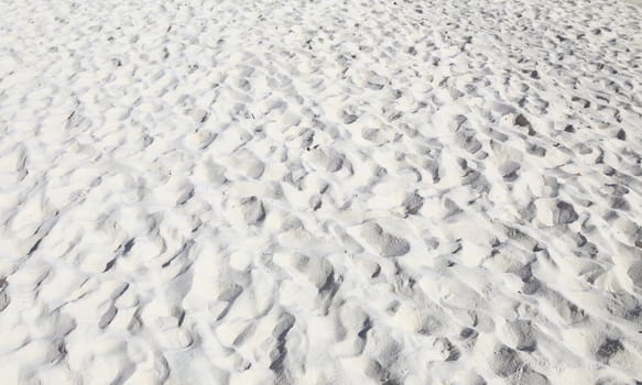 sand beach, wave and footsteps at sunset time