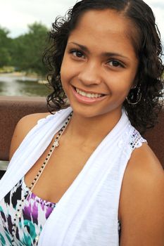 African American female beauty posing outside.