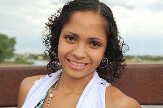 African American female beauty posing outside.