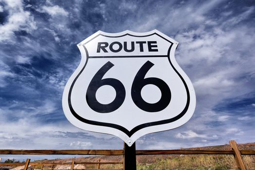 An old, nostalgic route 66 sign and sky