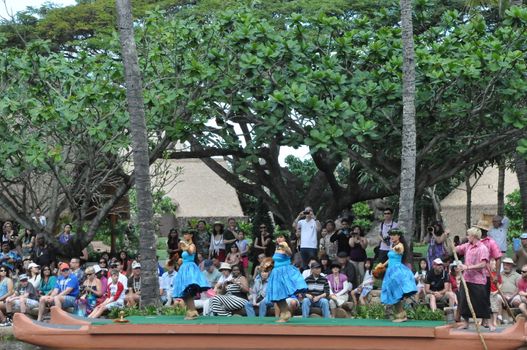 Students perform traditional Hawaiian dance at a canoe pageant at the Polynesian Cultural Center in Oahu, Hawaii