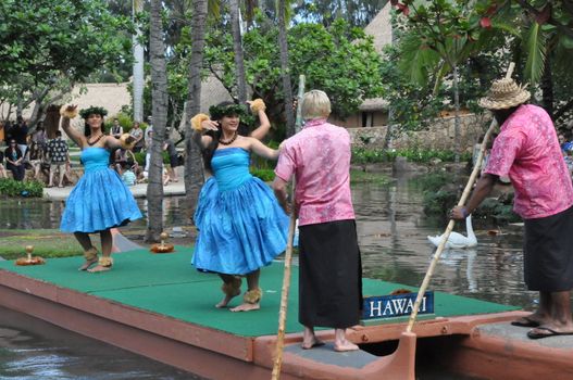 Students perform traditional Hawaiian dance at a canoe pageant at the Polynesian Cultural Center in Oahu, Hawaii