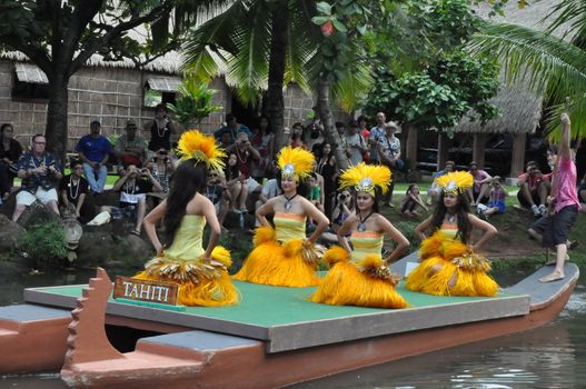 Students perform traditional Tahitian dance at a canoe pageant at the Polynesian Cultural Center in Oahu, Hawaii
