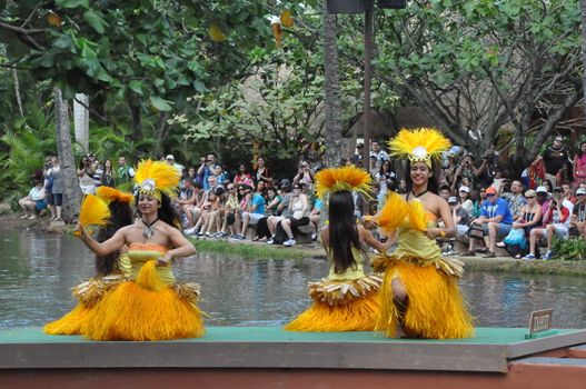 Students perform traditional Tahitian dance at a canoe pageant at the Polynesian Cultural Center in Oahu, Hawaii