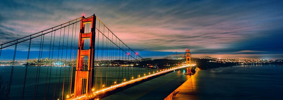 panoramic view of Golden Gate Bridge and San Francisco lights