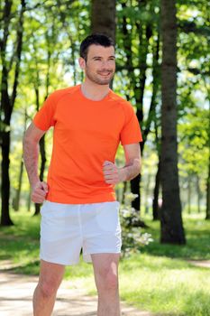 handsome man running in a park