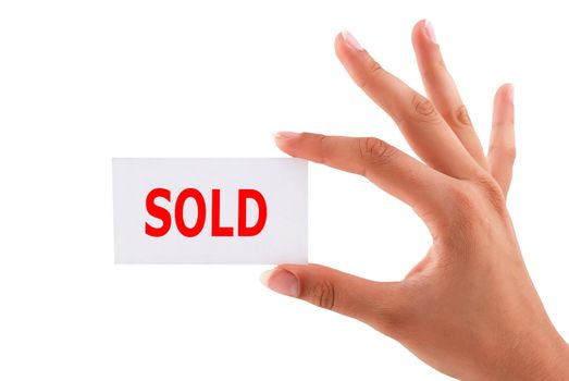 sold cards in hand on a white background