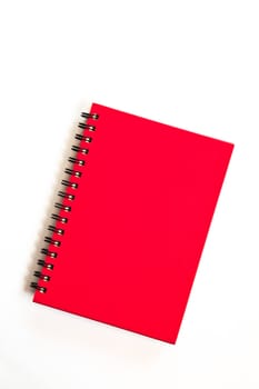 red notebook on white background