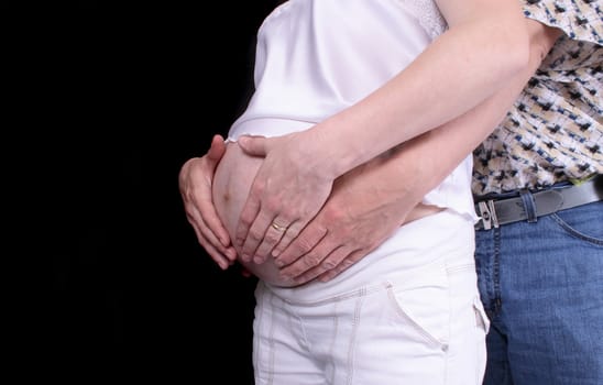 detail ofy young mother with fathers hands