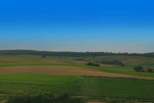 czech country with green grass and blue sky 