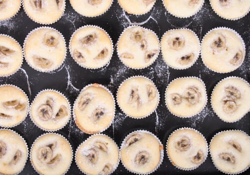 fresh banana muffins on the black background