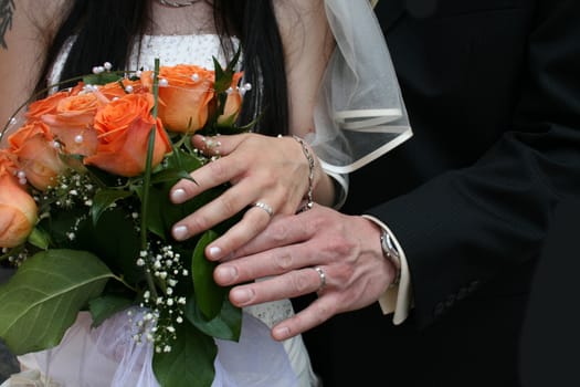 nice orange roses from the wedding and hands 